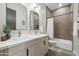 Modern bathroom with double vanity, white countertop, and a shower/tub combo at 3125 N 86Th Pl, Scottsdale, AZ 85251