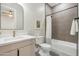 Clean bathroom with white toilet and bathtub at 3125 N 86Th Pl, Scottsdale, AZ 85251