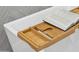 Bamboo bathtub caddy with slots for books and beverages at 3125 N 86Th Pl, Scottsdale, AZ 85251