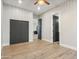 Bright bedroom with light hardwood floors and ceiling fan at 3125 N 86Th Pl, Scottsdale, AZ 85251