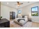 Spacious bedroom with a comfortable bed and large windows at 3125 N 86Th Pl, Scottsdale, AZ 85251