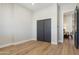 Light and airy bedroom with dark gray closet doors at 3125 N 86Th Pl, Scottsdale, AZ 85251