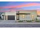 Modern house exterior with neutral color scheme and landscaped yard at 3125 N 86Th Pl, Scottsdale, AZ 85251