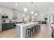 Spacious kitchen with open layout, stainless steel appliances, and large island at 3125 N 86Th Pl, Scottsdale, AZ 85251