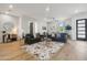 Open living area with contemporary furnishings and hardwood floors at 3125 N 86Th Pl, Scottsdale, AZ 85251