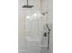 Modern shower with frameless glass enclosure and rainfall shower head at 3125 N 86Th Pl, Scottsdale, AZ 85251