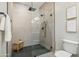 Walk-in shower with textured walls and modern fixtures at 3125 N 86Th Pl, Scottsdale, AZ 85251
