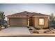 Single-story home with brown garage door and tile roof at 4833 S 251St Dr, Buckeye, AZ 85326