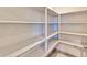 Walk-in pantry with ample shelving at 4833 S 251St Dr, Buckeye, AZ 85326