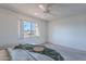 Bedroom with large window and ceiling fan at 7820 E Camelback Rd # 209, Scottsdale, AZ 85251