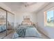 Bedroom with mirrored closet doors and a view at 7820 E Camelback Rd # 209, Scottsdale, AZ 85251