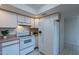 Bright kitchen with white appliances and ample cabinet space at 7820 E Camelback Rd # 209, Scottsdale, AZ 85251