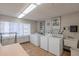 Community laundry room with several washers and dryers at 7820 E Camelback Rd # 209, Scottsdale, AZ 85251