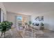 Bright living room with comfy seating, large windows, and access to a balcony at 7820 E Camelback Rd # 209, Scottsdale, AZ 85251