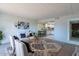 Open living room with kitchen and dining area visible at 7820 E Camelback Rd # 209, Scottsdale, AZ 85251
