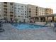 Inviting community pool with ample lounge chairs and patio tables at 7820 E Camelback Rd # 209, Scottsdale, AZ 85251
