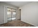 Bright bedroom with sliding glass doors to patio at 10108 N 95Th Dr # A, Peoria, AZ 85345