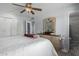 Bedroom with a queen-size bed and ensuite bathroom access at 10213 W Kingswood Cir, Sun City, AZ 85351