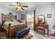 Spacious bedroom with wood furniture and ample natural light at 10213 W Kingswood Cir, Sun City, AZ 85351