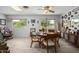 Dining area with wood table and chairs, and tile floors at 10213 W Kingswood Cir, Sun City, AZ 85351