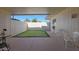 Private patio featuring artificial turf and seating area at 10214 W Hutton Dr, Sun City, AZ 85351