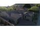 Aerial view of house with tile roof and a mountain backdrop at 25995 N 85Th Dr, Peoria, AZ 85383