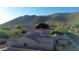 Aerial view of houses with tile roofs and mountain backdrop at 25995 N 85Th Dr, Peoria, AZ 85383