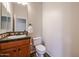 Powder room with single sink and toilet at 25995 N 85Th Dr, Peoria, AZ 85383