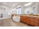 Main bathroom with double sinks, a large tub, and a separate shower at 25995 N 85Th Dr, Peoria, AZ 85383