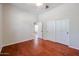 Bright bedroom with hardwood floors and double door closet at 25995 N 85Th Dr, Peoria, AZ 85383