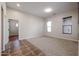 Spacious bedroom with carpet flooring and large windows at 25995 N 85Th Dr, Peoria, AZ 85383