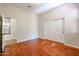 Spacious bedroom with hardwood floors and a double door closet at 25995 N 85Th Dr, Peoria, AZ 85383
