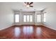 Well-lit bedroom featuring hardwood floors and large windows at 25995 N 85Th Dr, Peoria, AZ 85383
