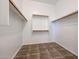 Walk-in closet with double hanging rods and shelving at 25995 N 85Th Dr, Peoria, AZ 85383
