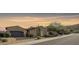 Stunning curb appeal featuring a two-car garage and desert landscaping at 25995 N 85Th Dr, Peoria, AZ 85383