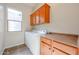 Laundry room with washer, dryer, and cabinets at 25995 N 85Th Dr, Peoria, AZ 85383