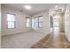 Living room with carpet flooring and multiple windows at 25995 N 85Th Dr, Peoria, AZ 85383