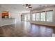 Large living room with tile flooring and multiple windows at 25995 N 85Th Dr, Peoria, AZ 85383