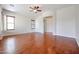 Bright living room with hardwood floors and ceiling fan at 25995 N 85Th Dr, Peoria, AZ 85383