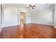 Spacious main bedroom with hardwood floors and ensuite bathroom at 25995 N 85Th Dr, Peoria, AZ 85383