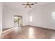 Bright living room with high ceilings, polished concrete floors, and sliding glass doors at 2753 W Kristina Ave, San Tan Valley, AZ 85144