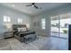 Spacious main bedroom with plush bed and sliding glass door access at 3311 S 197Th Dr, Buckeye, AZ 85326