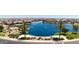Community features a large lake with walking paths and lush landscaping at 40000 W Bravo Dr, Maricopa, AZ 85138