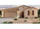 One-story home with a two-car garage and desert landscaping at 40000 W Bravo Dr, Maricopa, AZ 85138