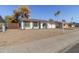 Charming ranch-style home with a spacious front yard and mature trees at 4226 W Royal Palm Rd, Phoenix, AZ 85051