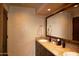 Double vanity bathroom with dark wood cabinets and tile flooring at 10040 E Happy Valley Rd # 504, Scottsdale, AZ 85255