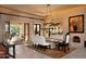 Elegant dining room with white banquette and a marble table at 10040 E Happy Valley Rd # 504, Scottsdale, AZ 85255