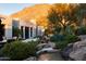 Stunning desert landscape with custom home; expansive patio with fireplace and water feature at 10040 E Happy Valley Rd # 504, Scottsdale, AZ 85255