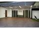 Spacious garage with built-in cabinets, sink, and golf simulator at 10040 E Happy Valley Rd # 504, Scottsdale, AZ 85255