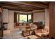 Relaxing Gathering room featuring a cozy window seat, fireplace, and ample natural light at 10040 E Happy Valley Rd # 504, Scottsdale, AZ 85255